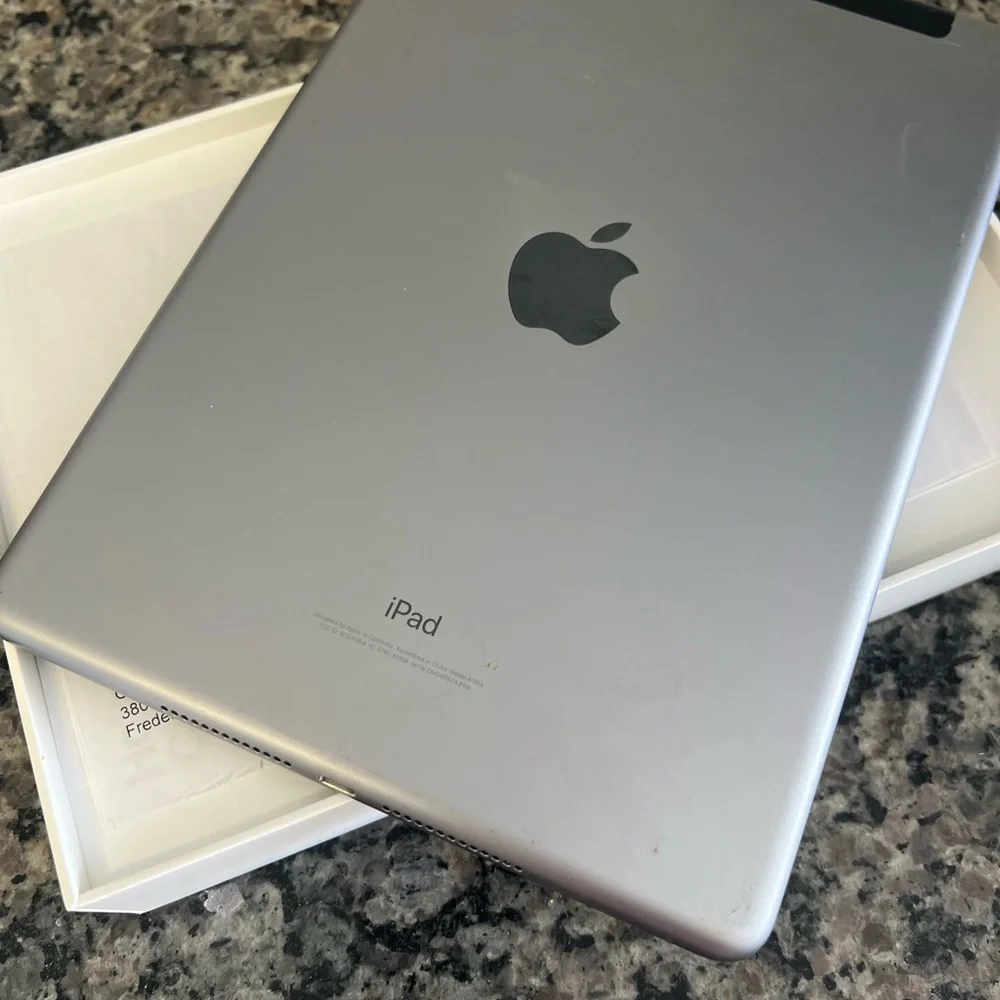 iPad 6th Generation, 32GB in excellent condition. This iPad features a 9.7-inch